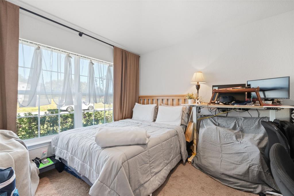 199 Bittern Loop Inverness, FL 34453 - Photo 12 of 36 a bedroom with a bed and a window