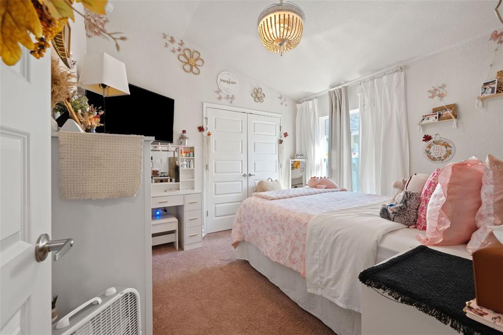 199 Bittern Loop Inverness, FL 34453 - Photo 13 of 36 a bedroom with a bed and a flat screen tv