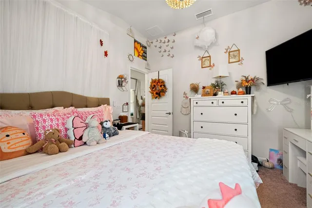 a bathroom with a granite countertop sink and a toilet