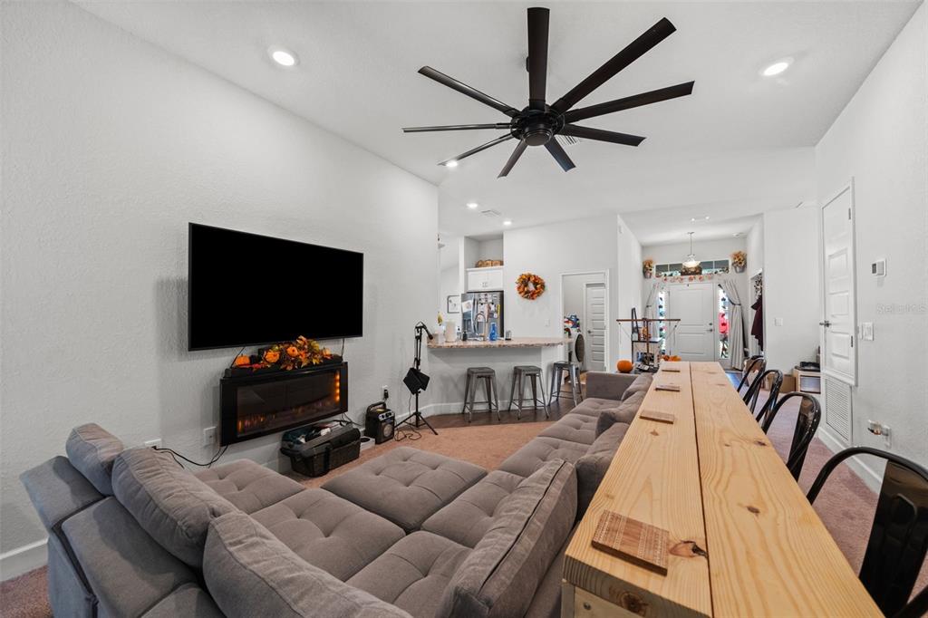 199 Bittern Loop Inverness, FL 34453 - Photo 26 of 36 a living room with furniture and a flat screen tv
