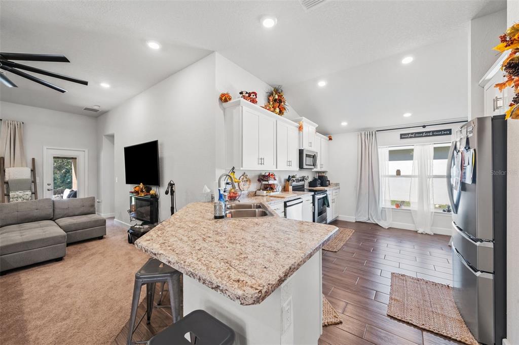 199 Bittern Loop Inverness, FL 34453 - Photo 27 of 36 a kitchen with a table and chairs in it