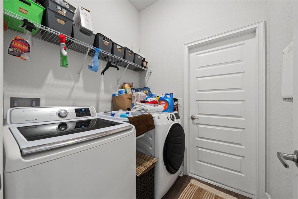 199 Bittern Loop Inverness, FL 34453 - Photo 31 of 36 a utility room with dryer and washer