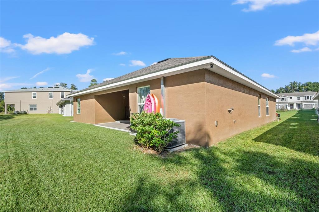 199 Bittern Loop Inverness, FL 34453 - Photo 5 of 36 a view of a backyard with potted plants