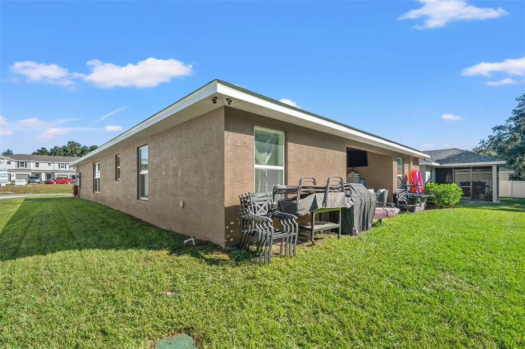 199 Bittern Loop Inverness, FL 34453 - Photo 7 of 36 a front view of a house with garden