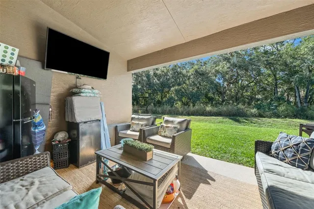 a view of living room with furniture and wooden floor