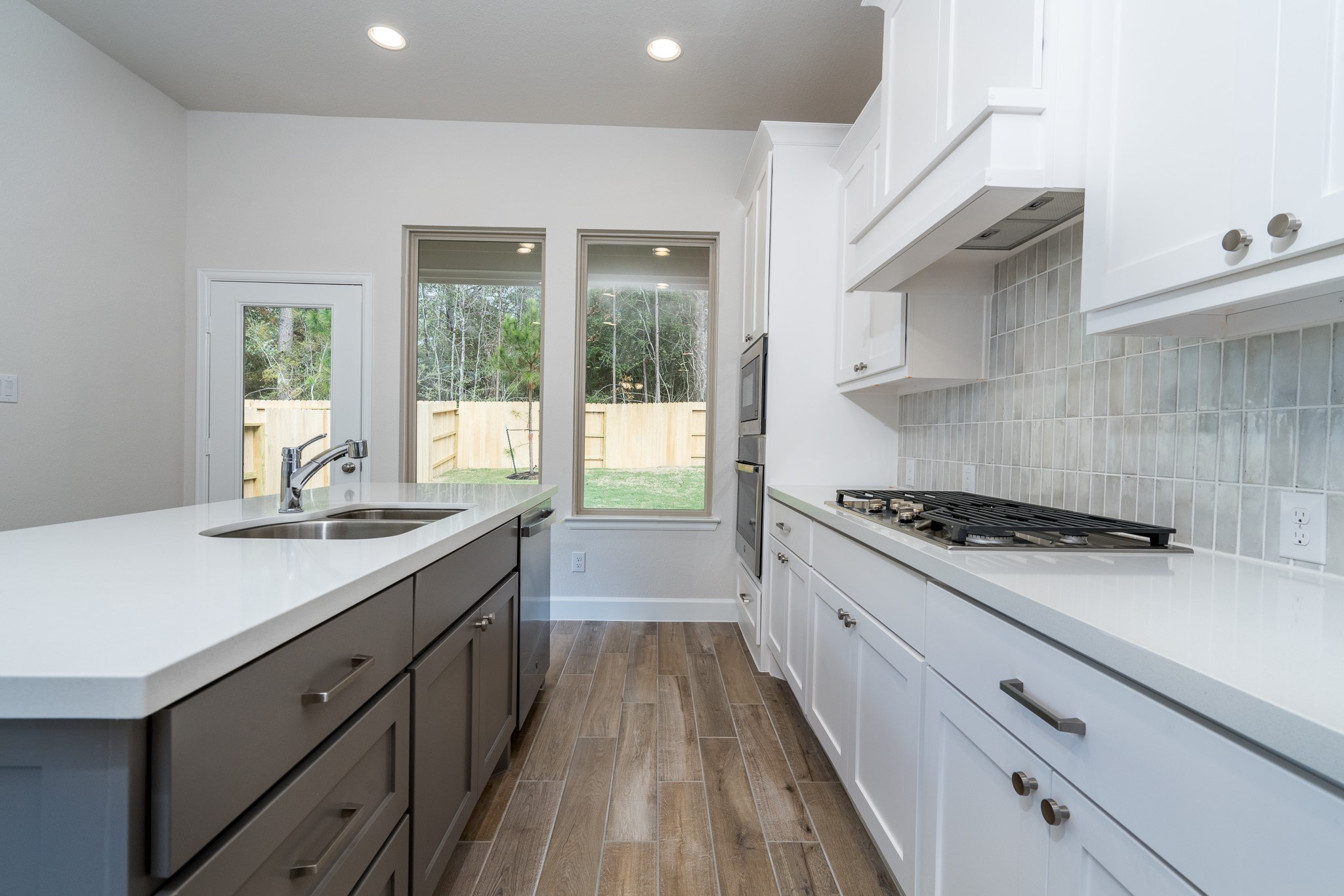 30314 Ruby Frst Court Magnolia, TX 77354 - Photo 11 of 29 a kitchen with a stove and a sink