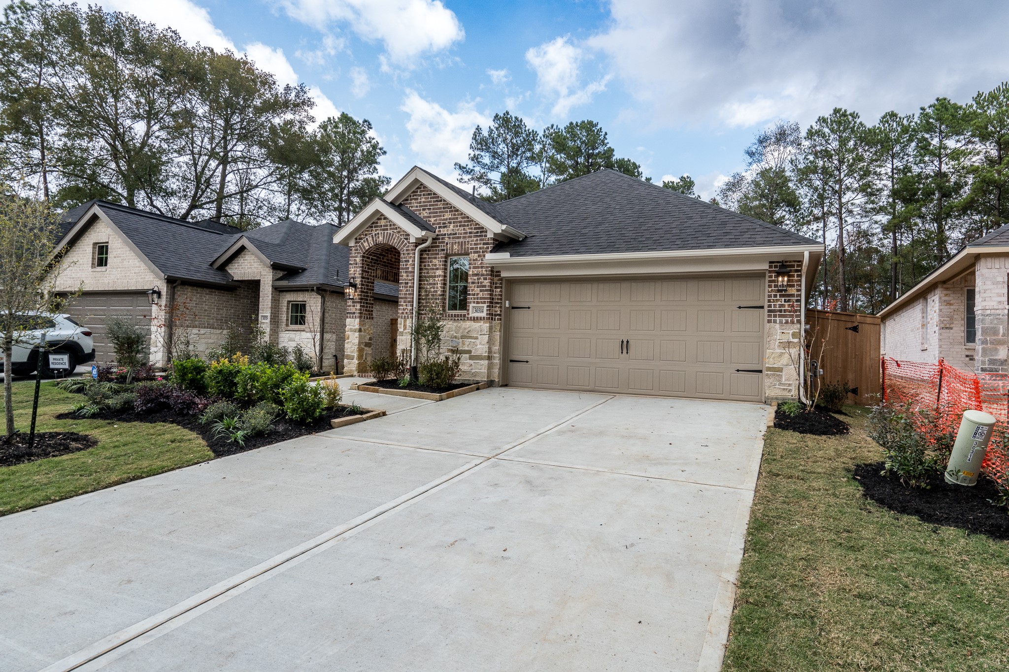 30314 Ruby Frst Court Magnolia, TX 77354 - Photo 25 of 29 a front view of a house with a garden