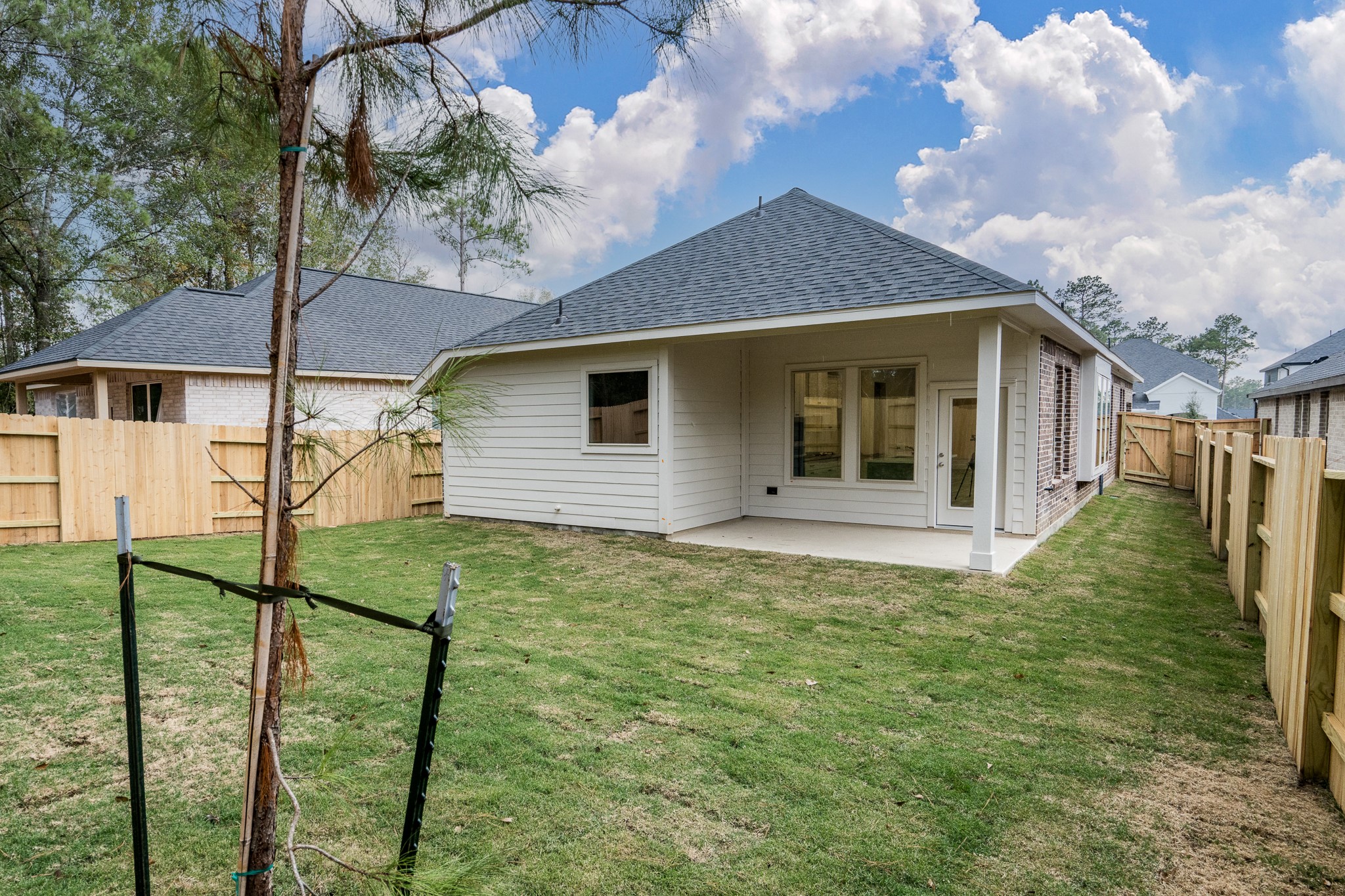30314 Ruby Frst Court Magnolia, TX 77354 - Photo 4 of 29 a front view of a house with garden