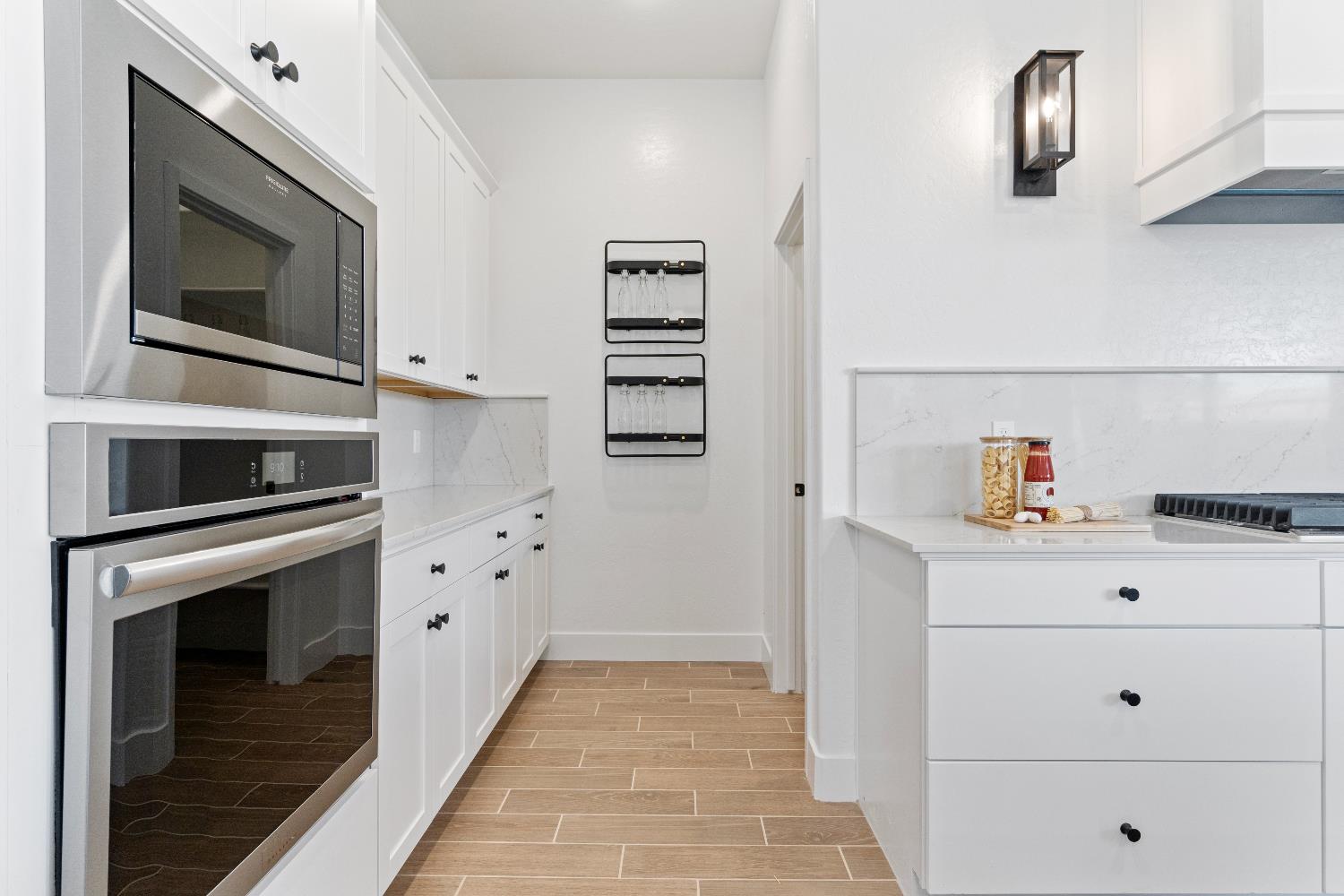 856 Traverse Drive Madera, CA 93636 - Photo 21 of 34 a kitchen with cabinets and steel stainless steel appliances
