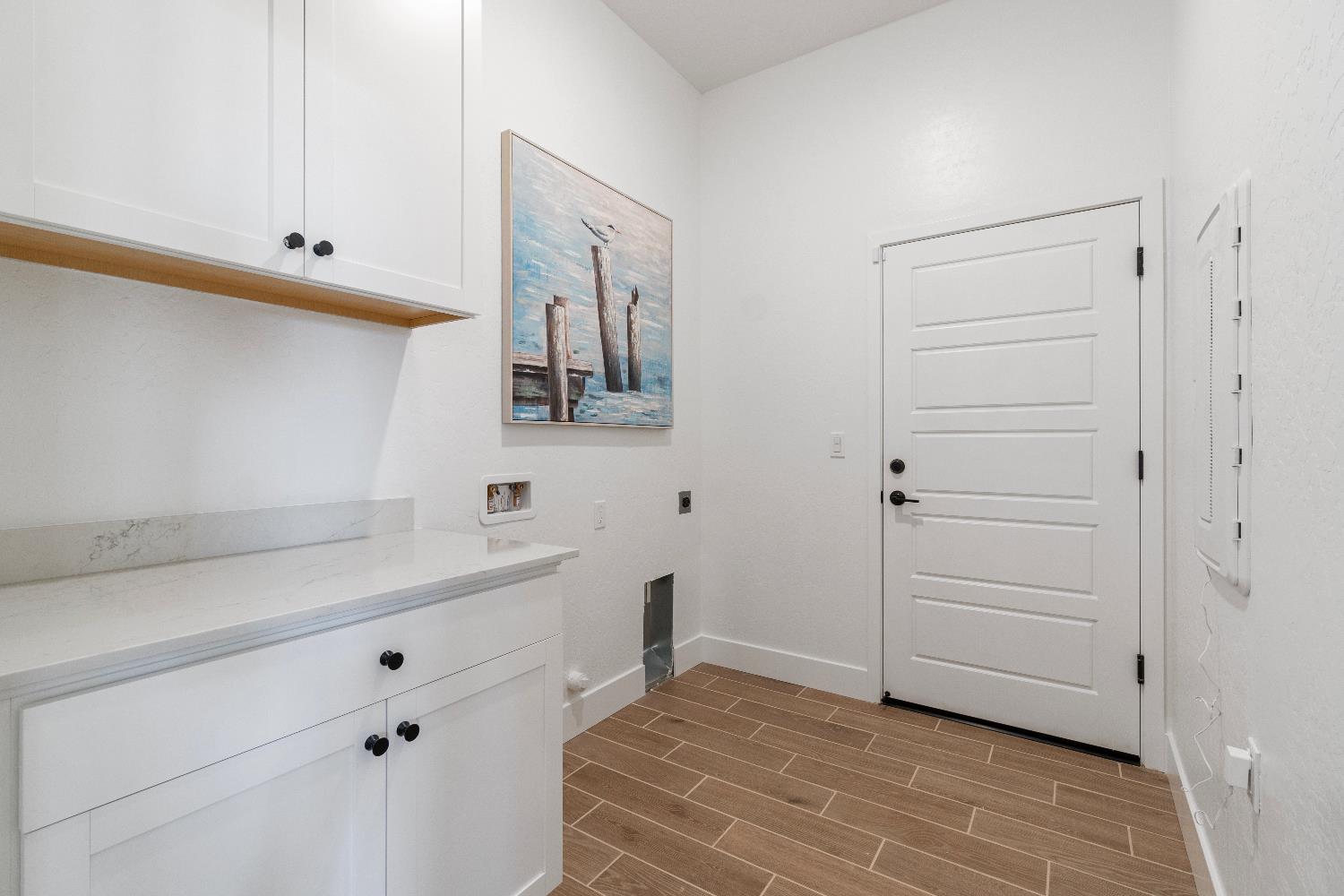 856 Traverse Drive Madera, CA 93636 - Photo 23 of 34 a room with a walk in closet and wooden floor
