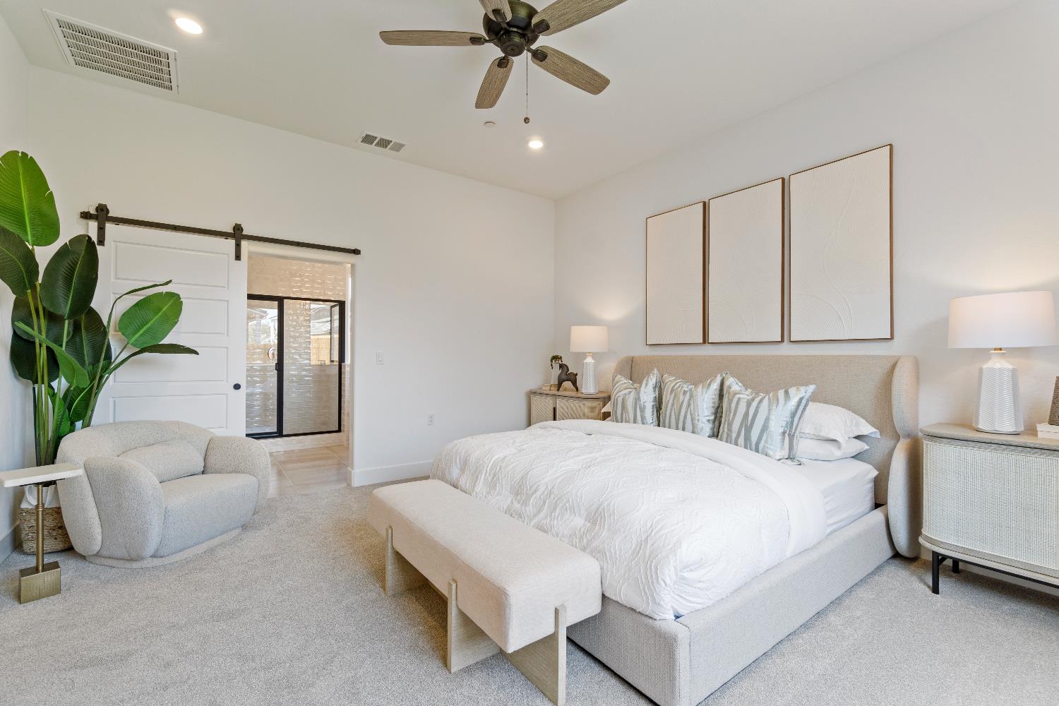 856 Traverse Drive Madera, CA 93636 - Photo 29 of 34 a bedroom with a bed and a chandelier