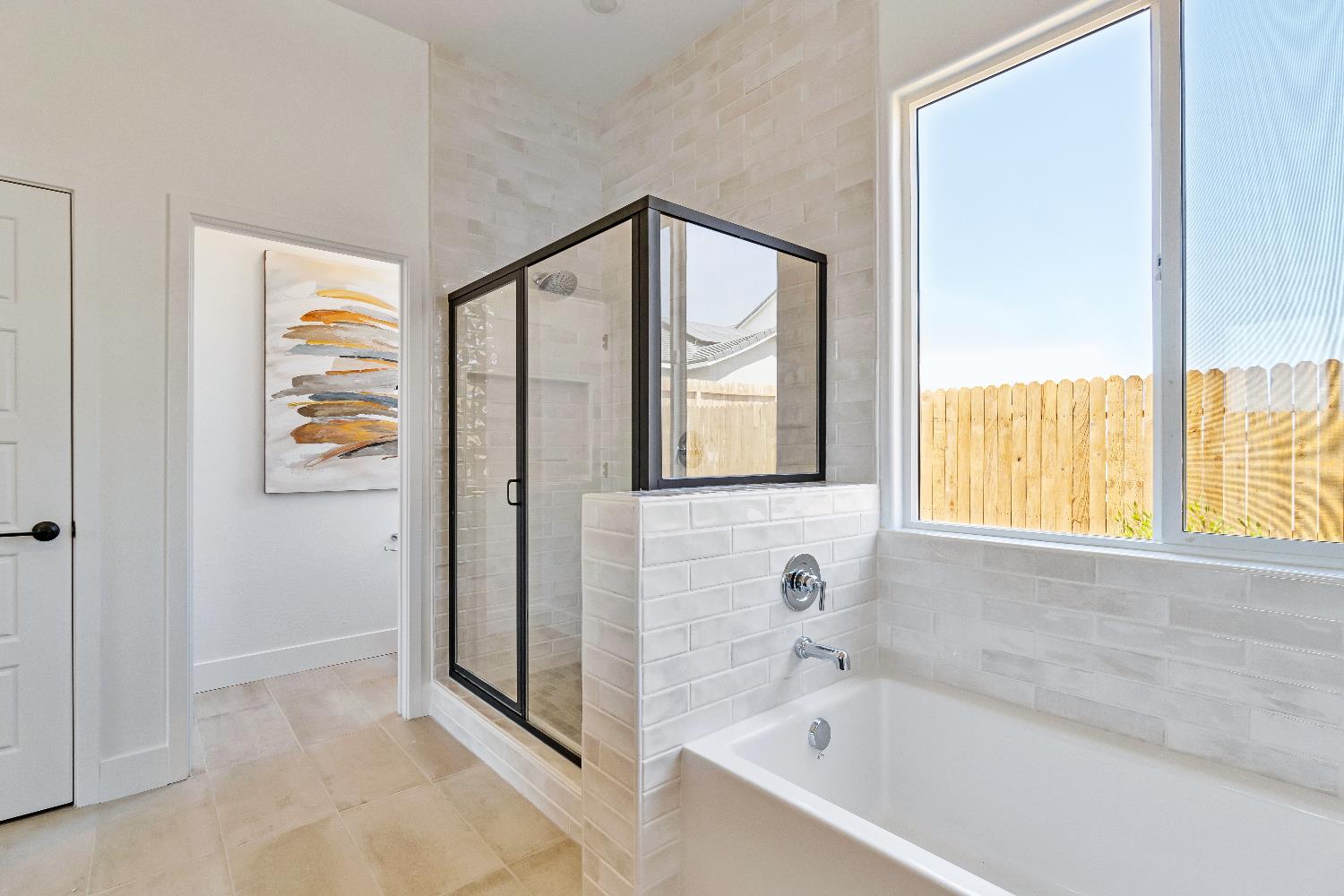 856 Traverse Drive Madera, CA 93636 - Photo 34 of 34 a bathroom with a bathtub and a shower