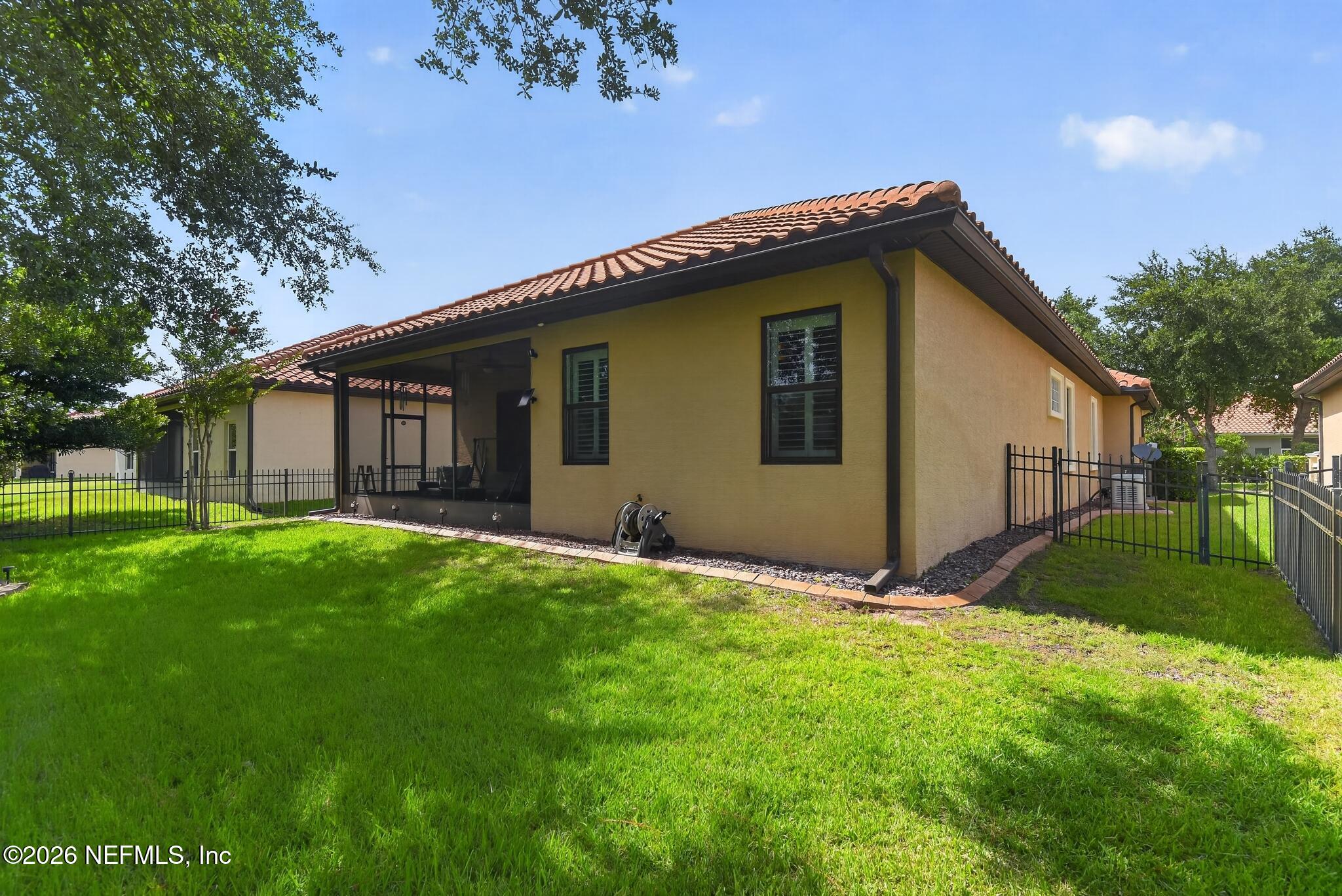 110 Vía Roma Ormond Beach, FL 32174 - Photo 42 of 43 a house with garden in front of it