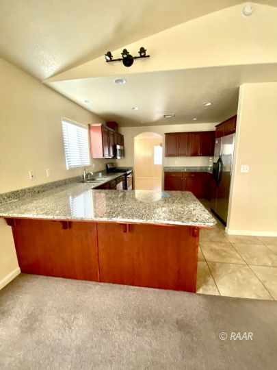 935 West Wasp Avenue Ridgecrest, CA 93555 - Photo 9 of 27 a view of kitchen and kitchen with sink