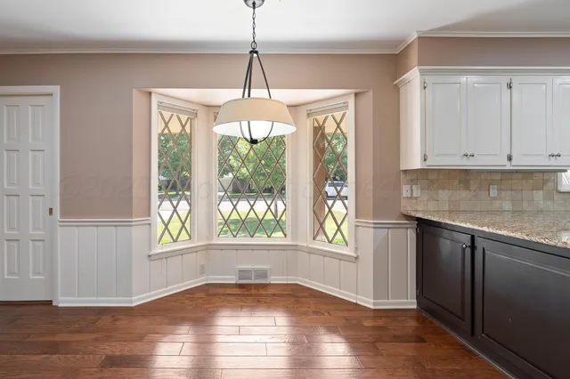 a kitchen with granite countertop white cabinets and a granite counter tops