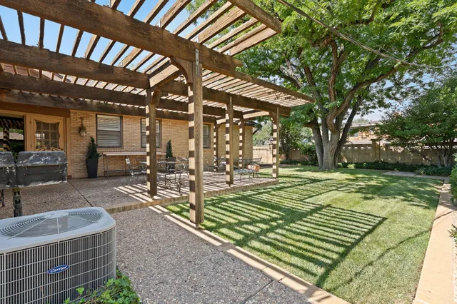 a view of backyard with a small cabin