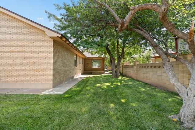 a view of a backyard with chairs