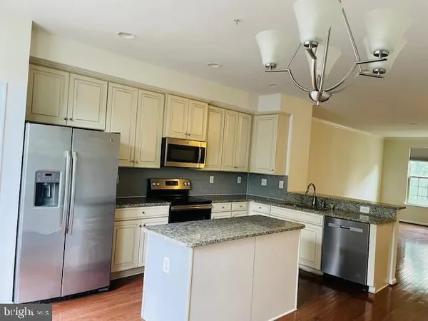 a view of a wooden balcony and trees