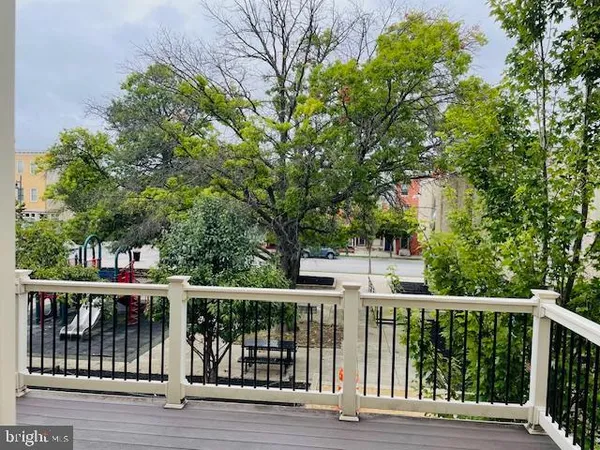 a view of hallway with wooden floor