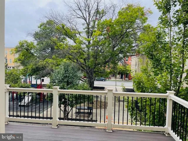a view of hallway with wooden floor