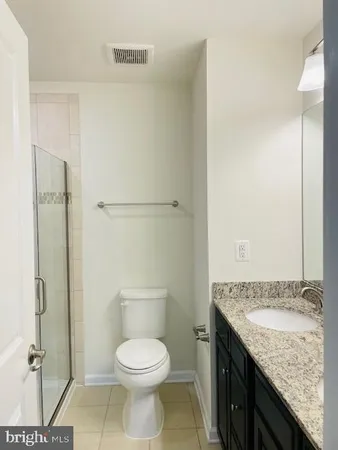 a view of a room with a ceiling fan