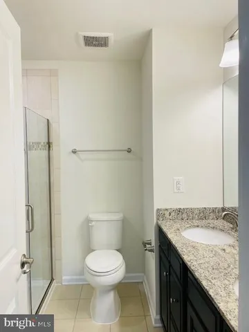 a view of a room with a ceiling fan