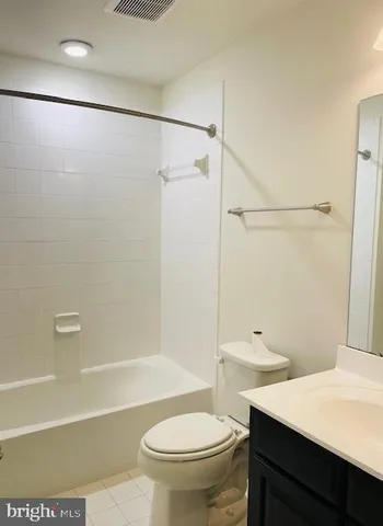 a bathroom with a sink a toilet and a bathtub