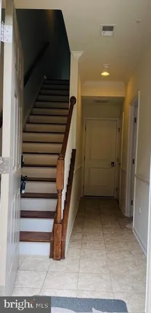 a view of a wooden deck and backyard