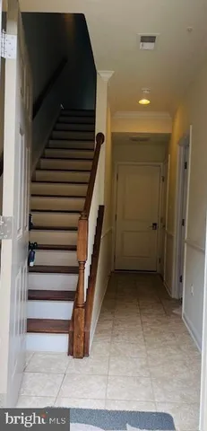 a view of a wooden deck and backyard