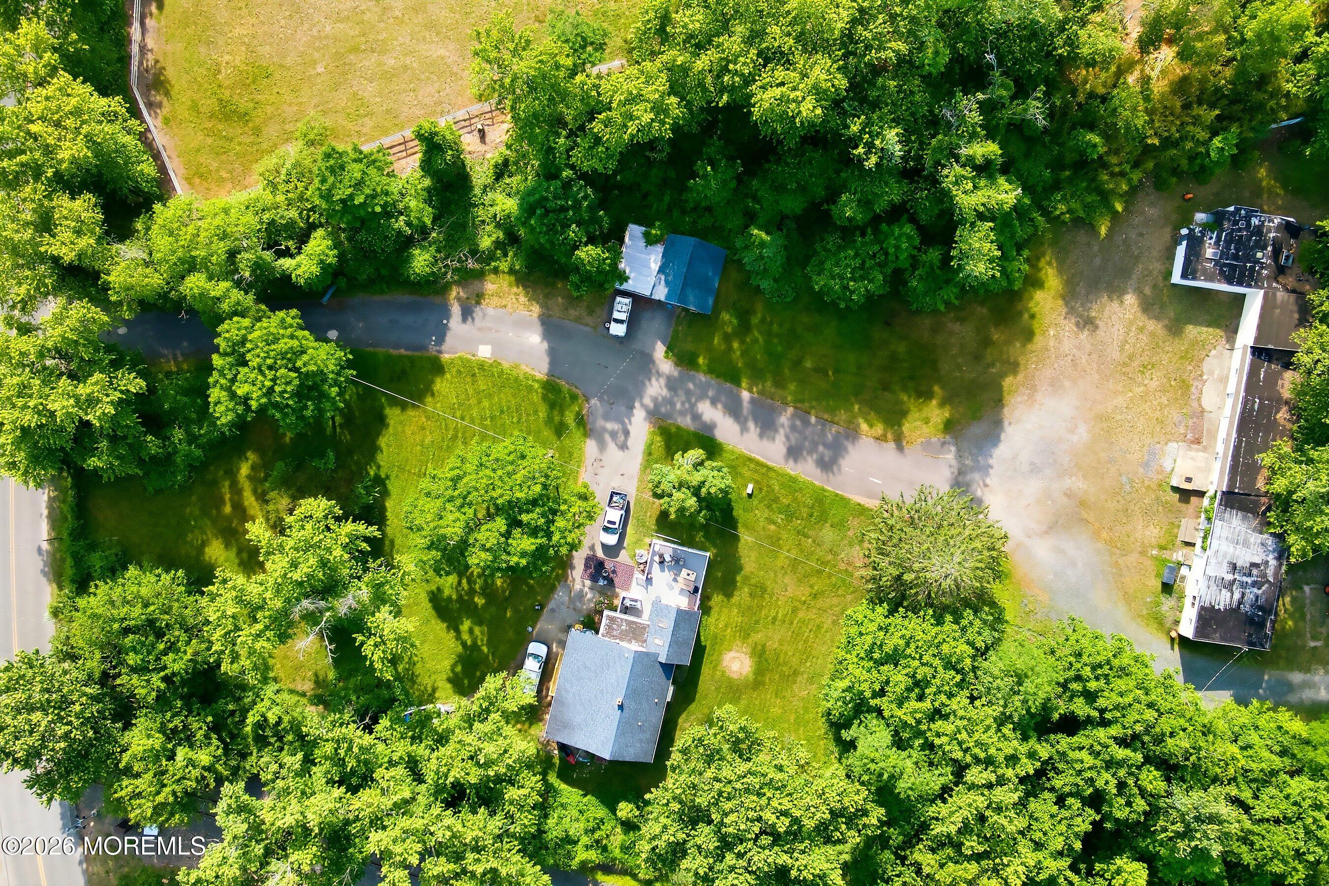26 Megill Road Farmingdale, NJ 07727 - Photo 13 of 16 an aerial view of a house with a yard and lake view