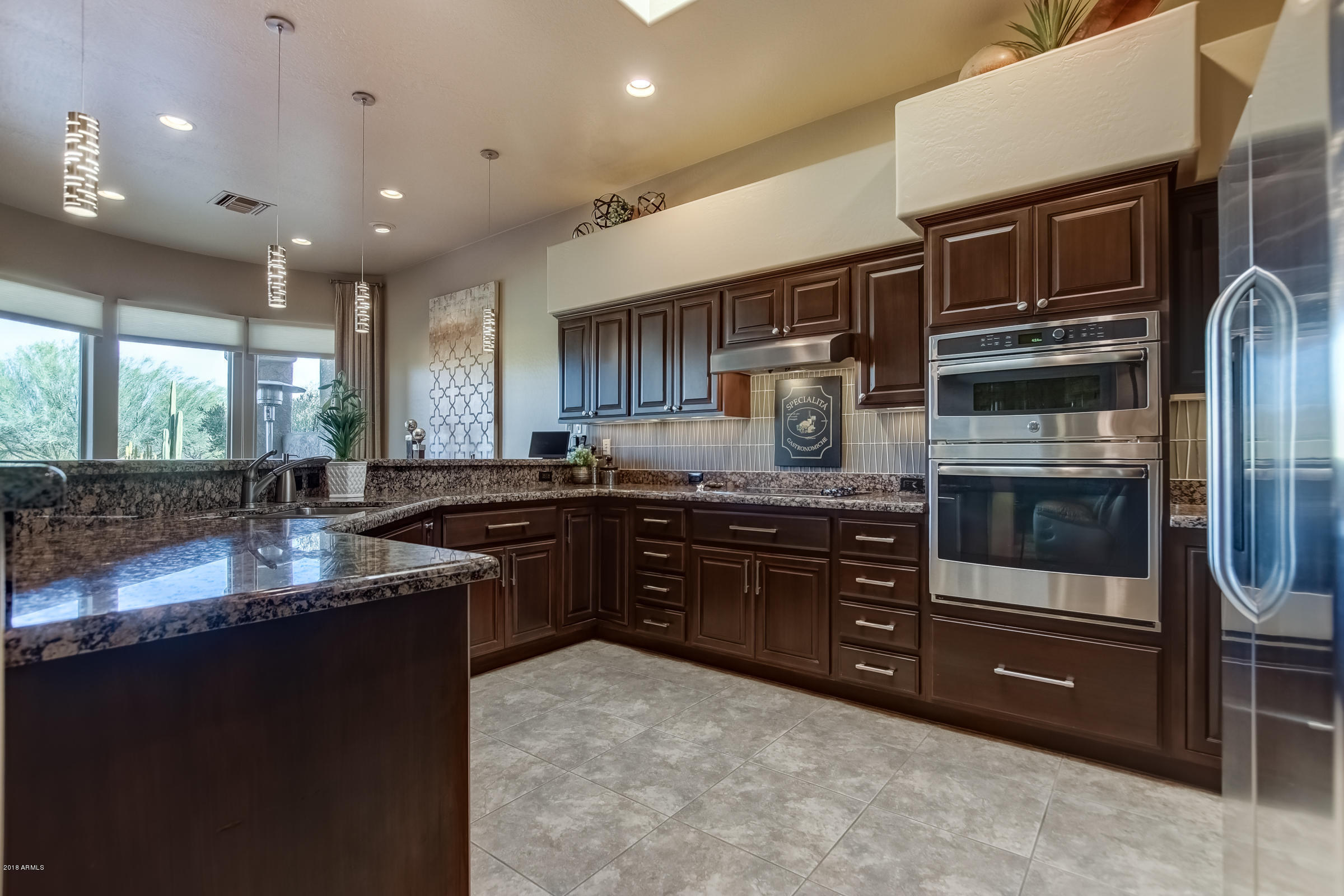 27833 North Granite Mountain Road Rio Verde, AZ 85263 - Photo 15 of 48 a kitchen with stainless steel appliances granite countertop a refrigerator and a sink