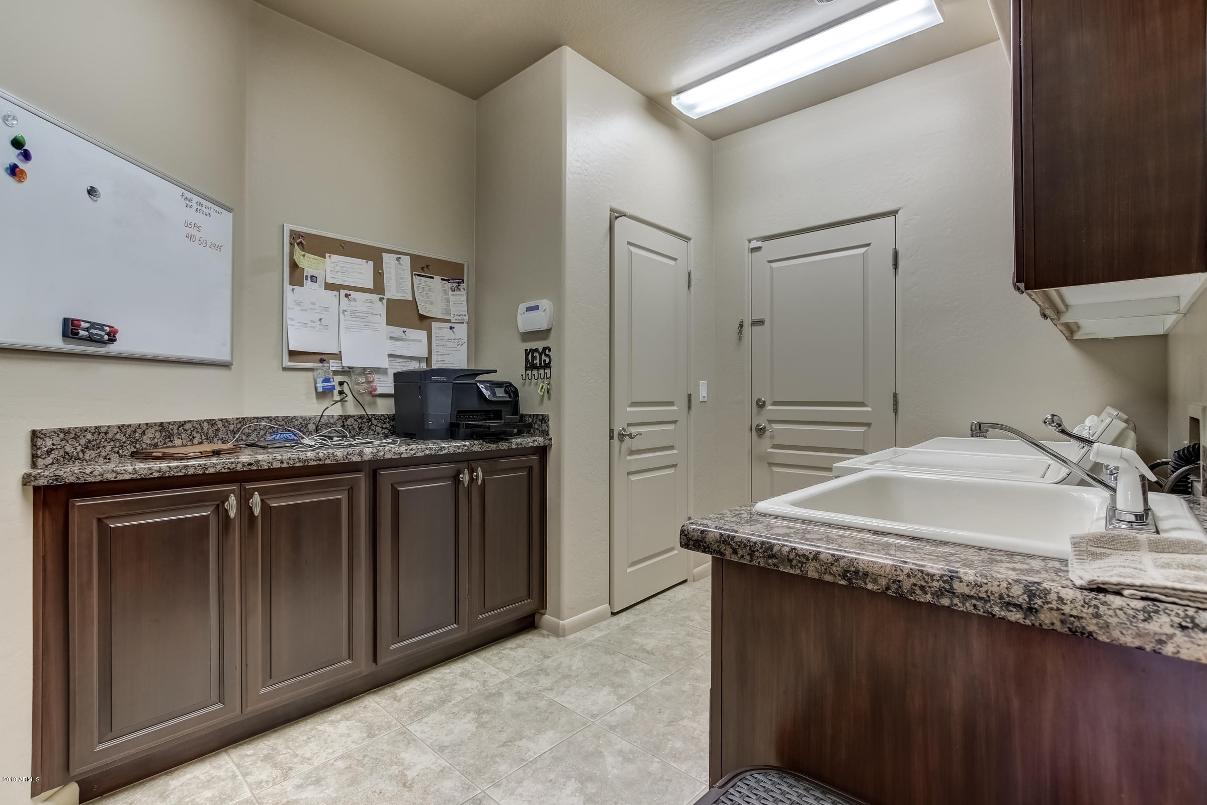 27833 North Granite Mountain Road Rio Verde, AZ 85263 - Photo 29 of 48 a kitchen with granite countertop a sink stove and refrigerator