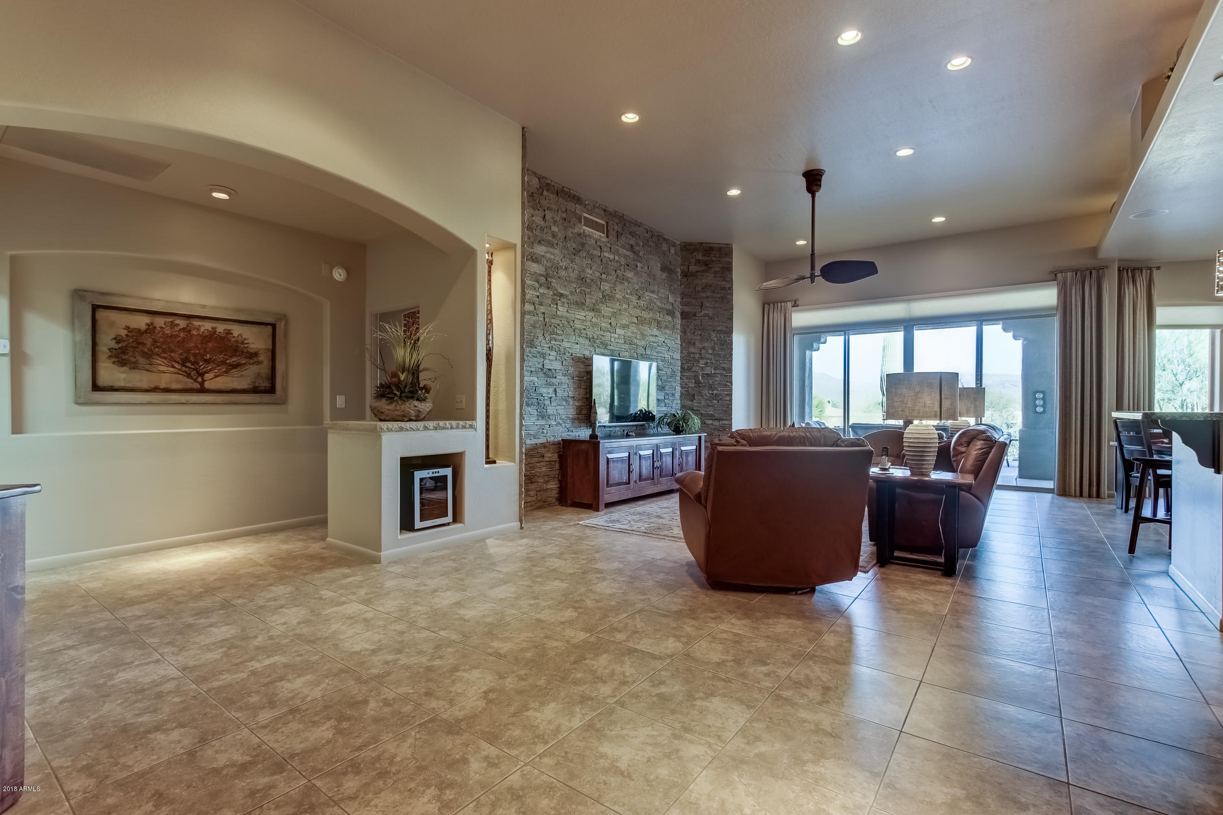 27833 North Granite Mountain Road Rio Verde, AZ 85263 - Photo 5 of 48 a living room with furniture and a open kitchen