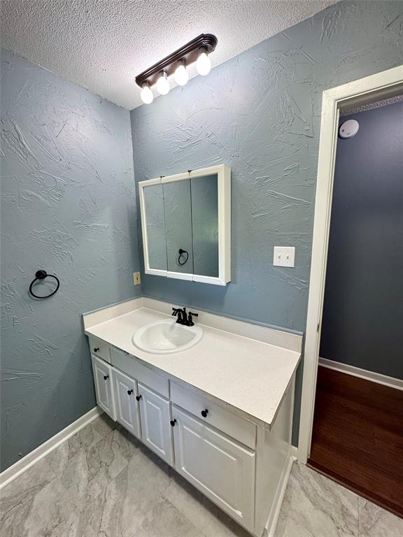 4170 Farm To Market 51 Decatur, TX 76234 - Photo 26 of 36 a bathroom with a sink and a mirror