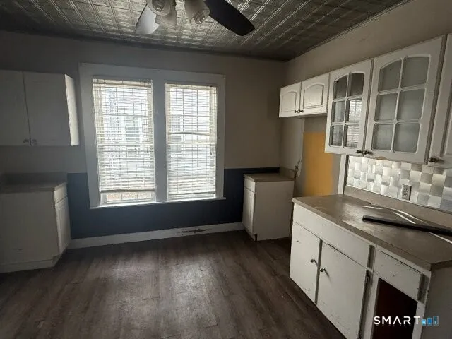 a kitchen with a sink and wooden cabinets