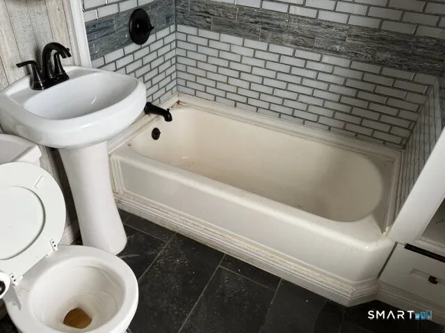 a bathroom with a sink and a toilet
