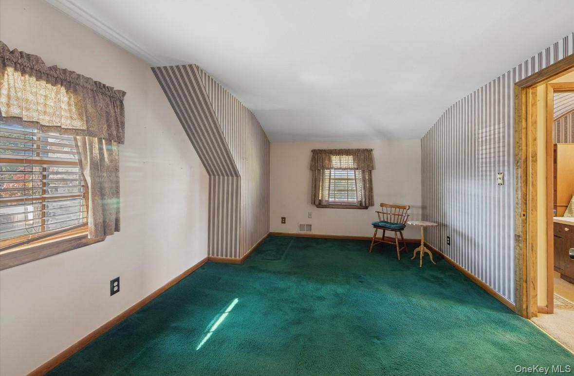 43 Briarcliff Road Westbury, NY 11590 - Photo 12 of 15 a view of a room that has a window and a chair
