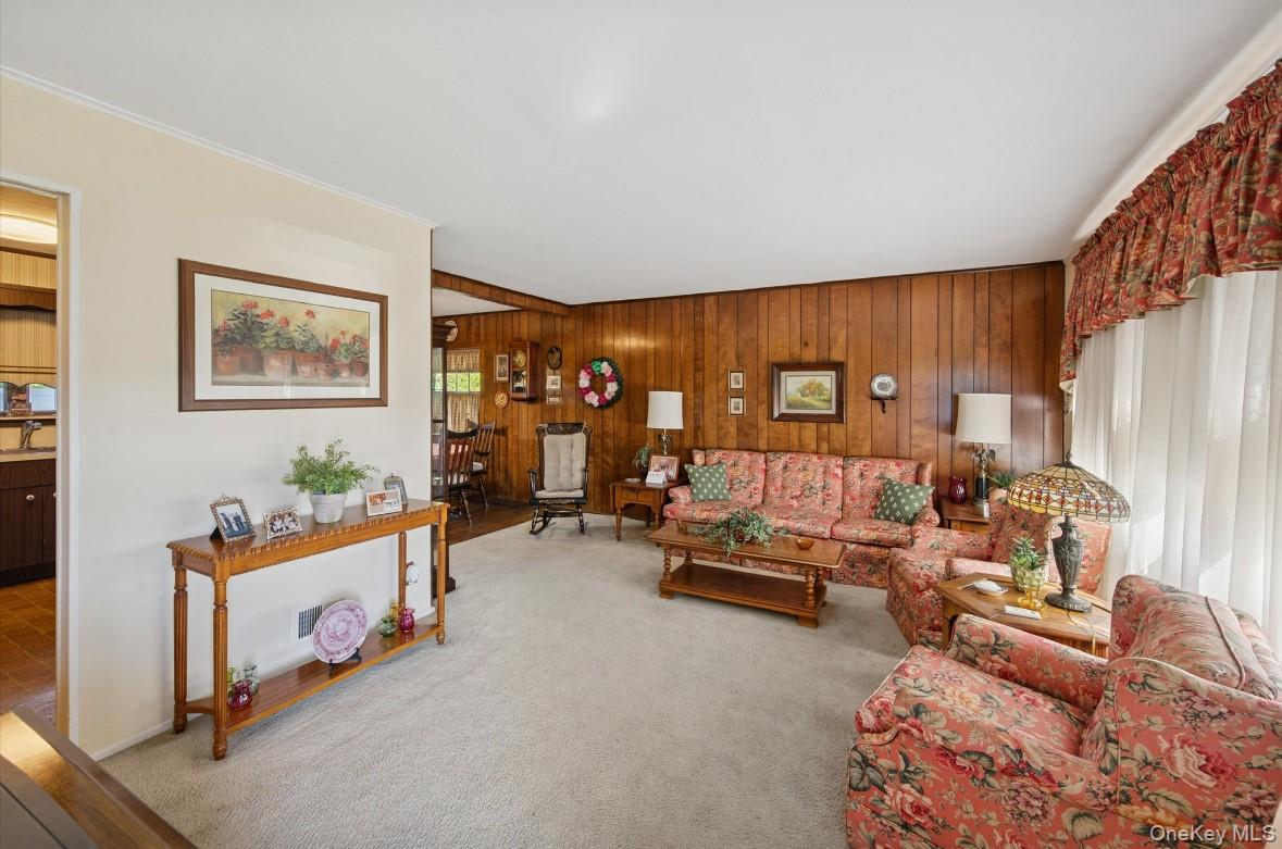 43 Briarcliff Road Westbury, NY 11590 - Photo 6 of 15 a bedroom with furniture and a large window