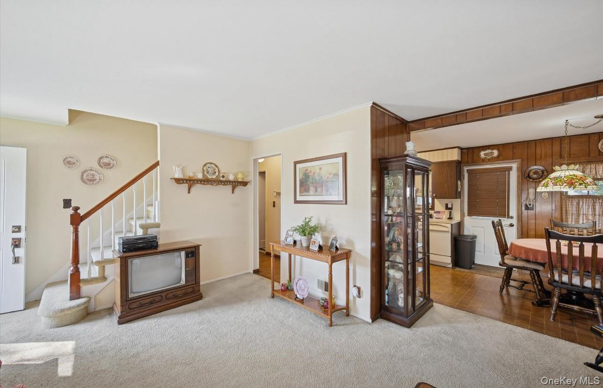 43 Briarcliff Road Westbury, NY 11590 - Photo 7 of 15 a view of a livingroom with furniture and an empty room
