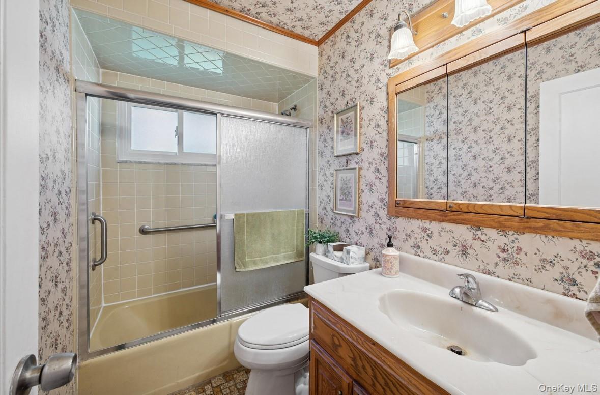 43 Briarcliff Road Westbury, NY 11590 - Photo 10 of 15 a bathroom with a sink toilet and shower