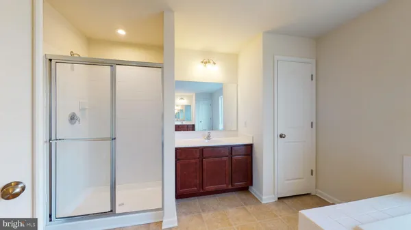 a bathroom with a sink and mirror
