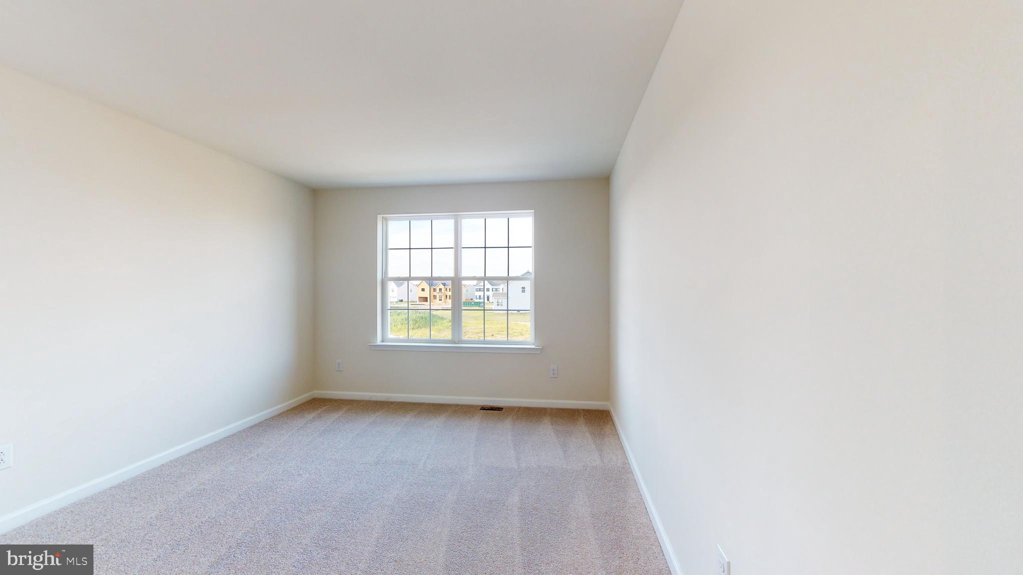 211 Laks Court, Unit CHARLESTON Smyrna, DE 19977 - Photo 19 of 24 an empty room with a window
