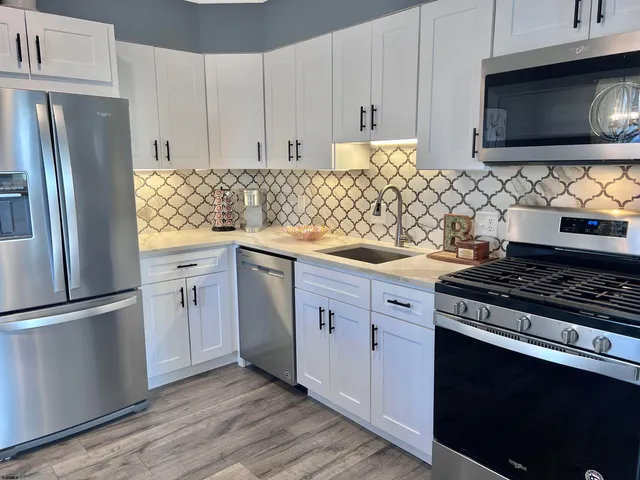 a dining room with table and chairs