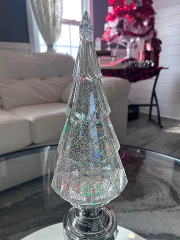 a hallway with wooden floor windows and a bathroom
