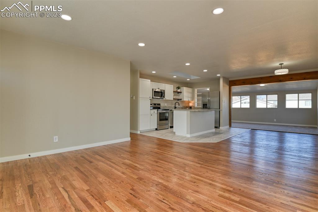 1422 Alexander Road Colorado Springs, CO 80909 - Photo 3 of 41 a view of kitchen with wooden floor