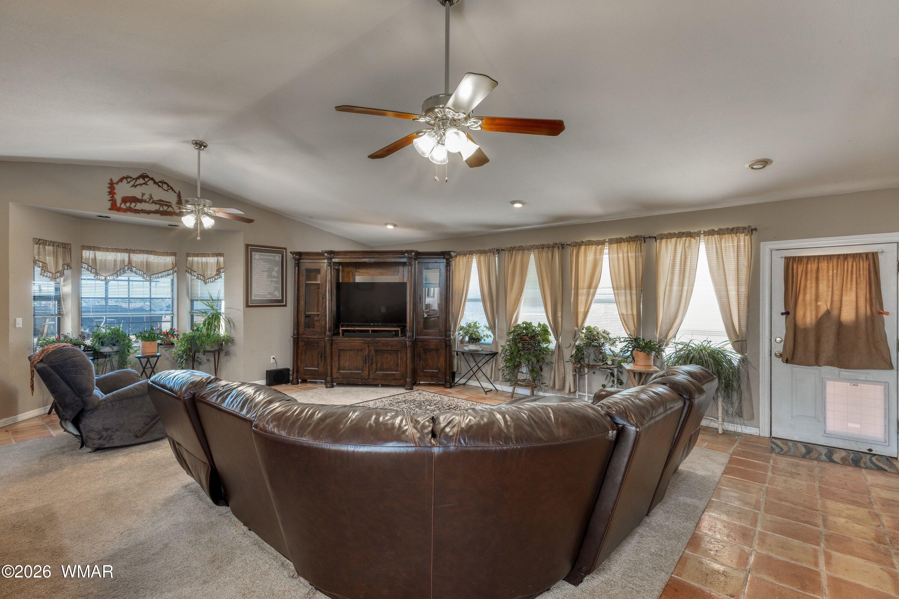 1114 Ranch Road Taylor, AZ 85939 - Photo 8 of 32 a living room with furniture and a flat screen tv