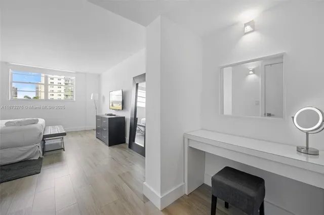 a living room with furniture a dining table and chairs