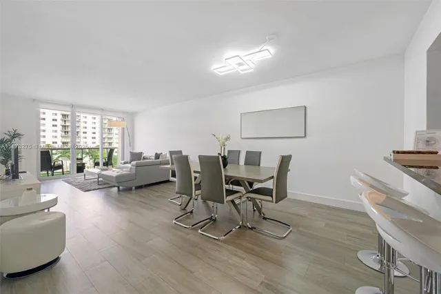 a work room with furniture and a wooden floor