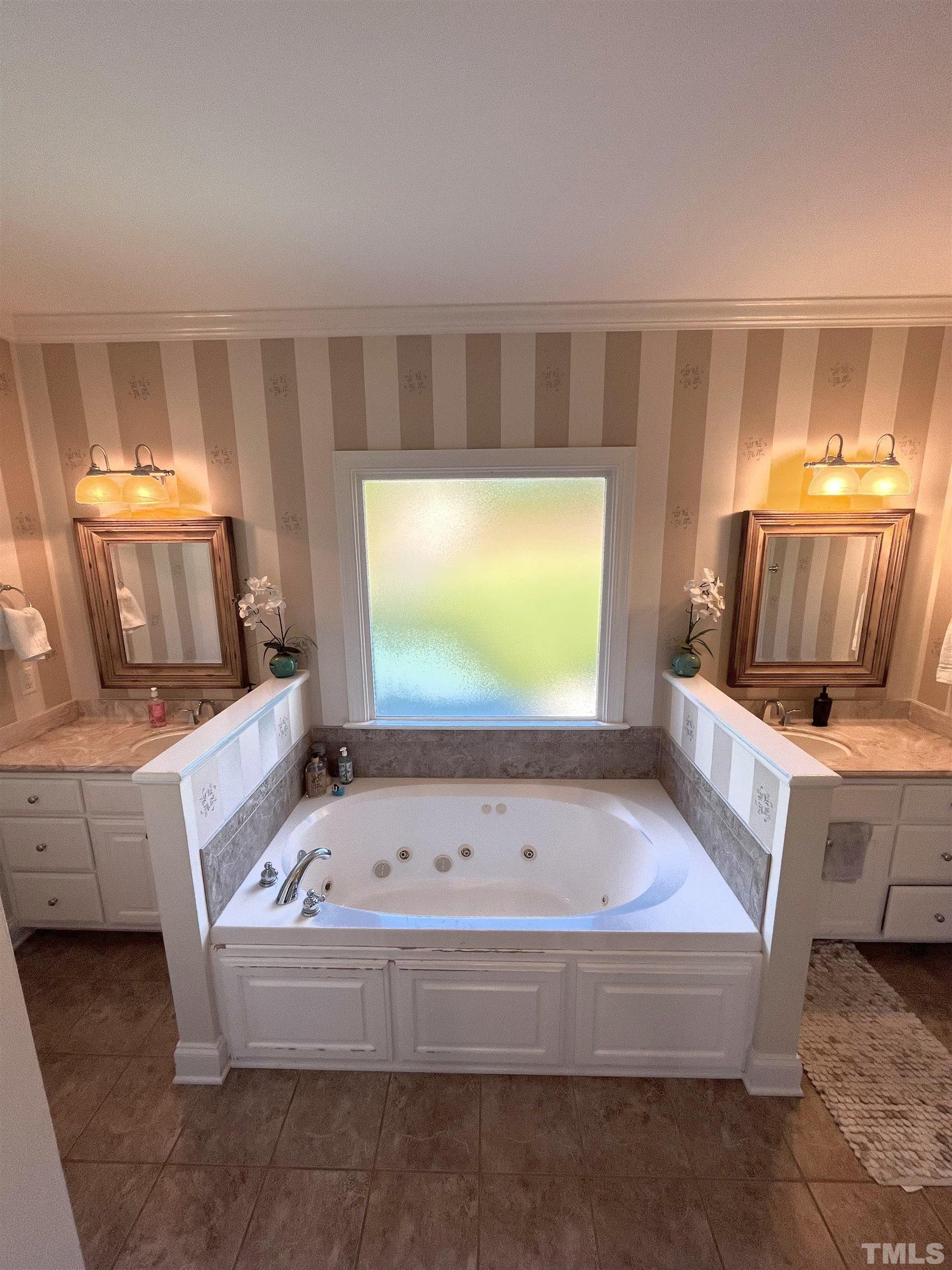 3098 Creek Point Road Haw River, NC 27258 - Photo 11 of 21 a bathroom with a bathtub and a double vanity sink