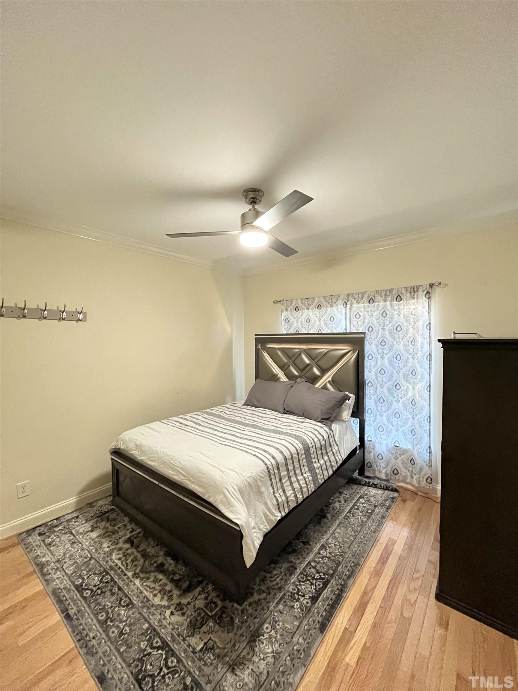 3098 Creek Point Road Haw River, NC 27258 - Photo 16 of 21 a bedroom with a bed and wooden floor